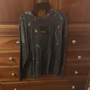 NWT adorable grey with neon spray paint look sweater hoodie.